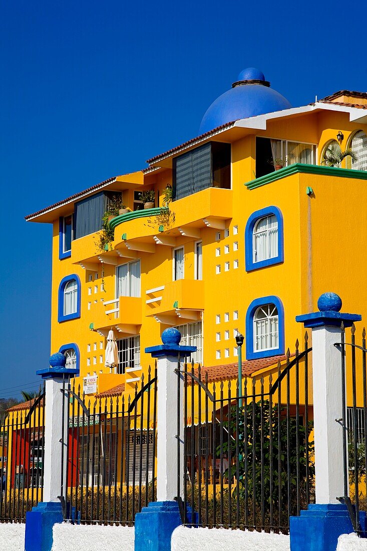 Santa Cruz, Huatulco, Oaxaca State, Mexico; Gate In Front Of Colorful Hotel