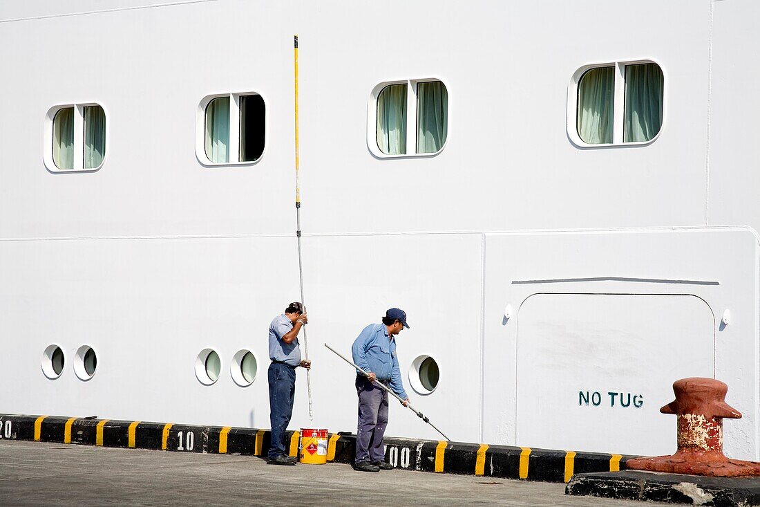 Puerto Corinto, Chinandega, Nicaragua, Central America; Workers Painting Cruise Ship