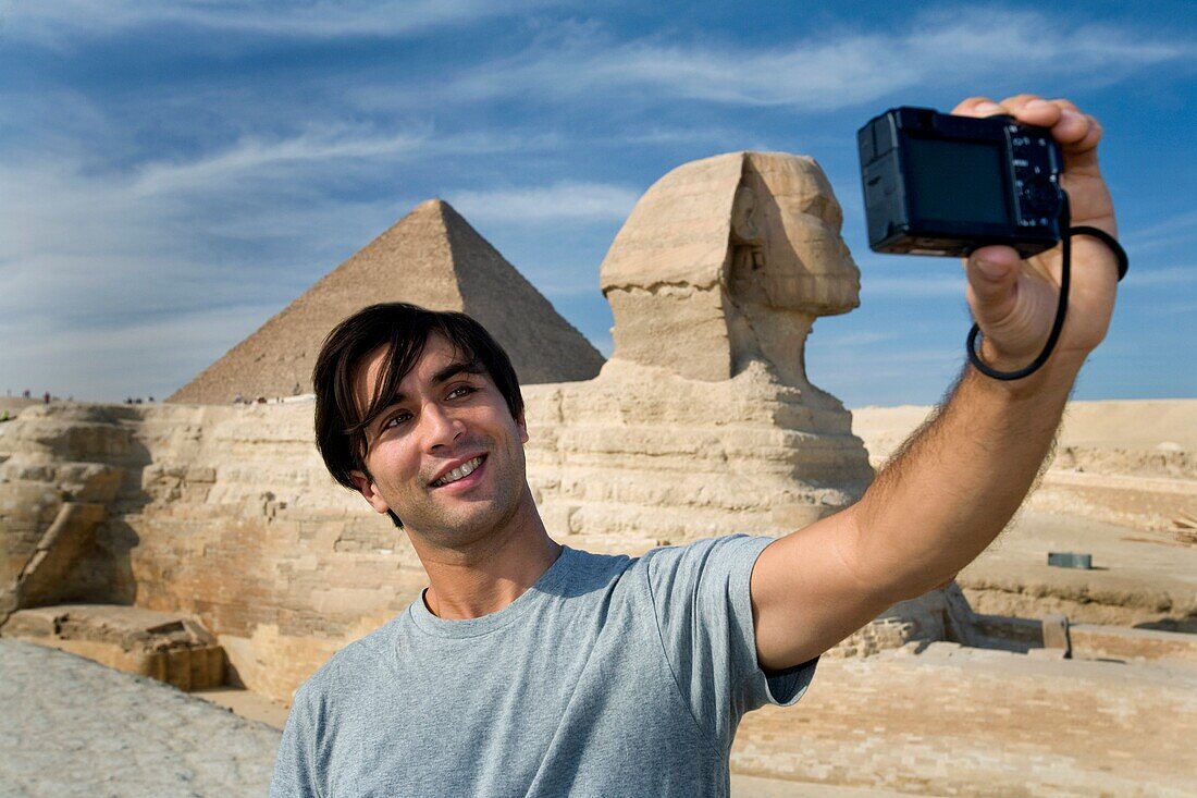 Man Taking A Picture Of Himself With Sphinx In Background