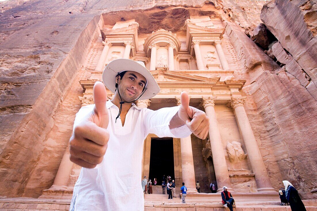 Man Giving Thumbs Up Standing By Al Khazneh In Petra