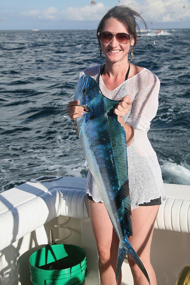 Woman Holding Newly Caught Fish, Cabo San Lucas, Mexico