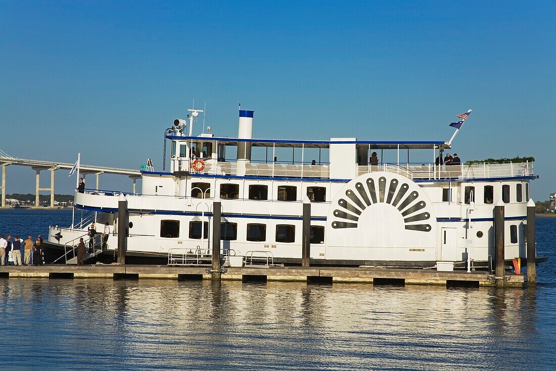 Tour Boat And Arthur Ravenel Jr. Bridge, Liberty Square; Charleston, South Carolina, United States Of America