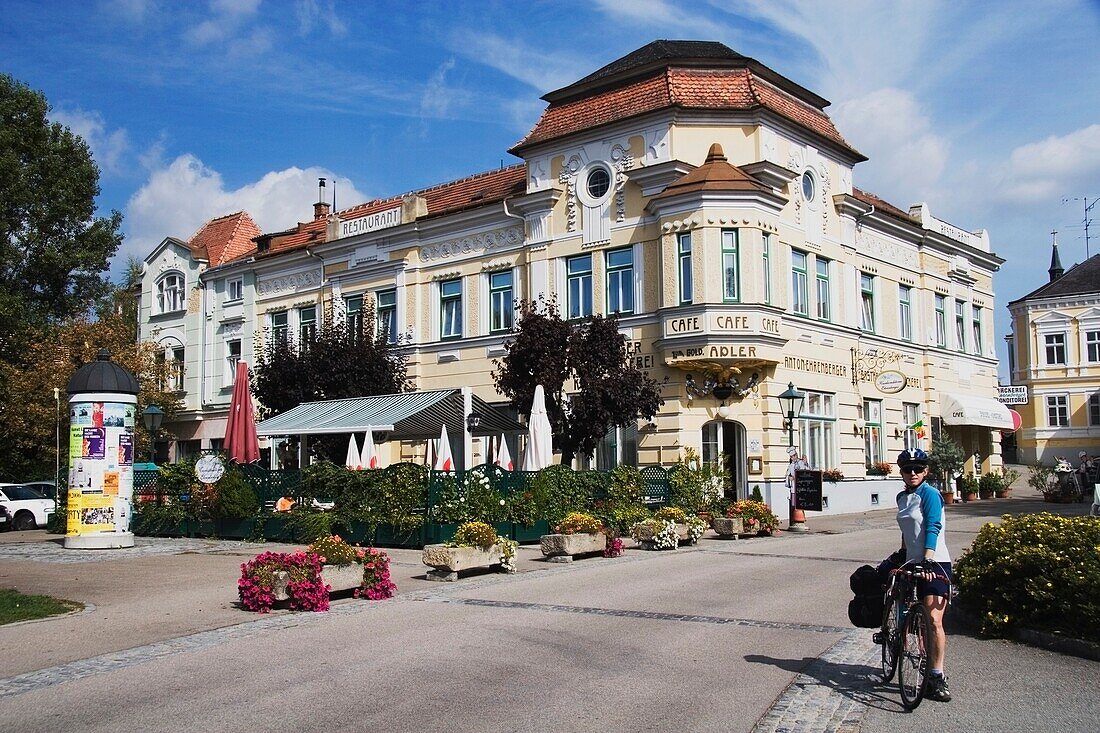 Woman On A Bike On A Street; Austria