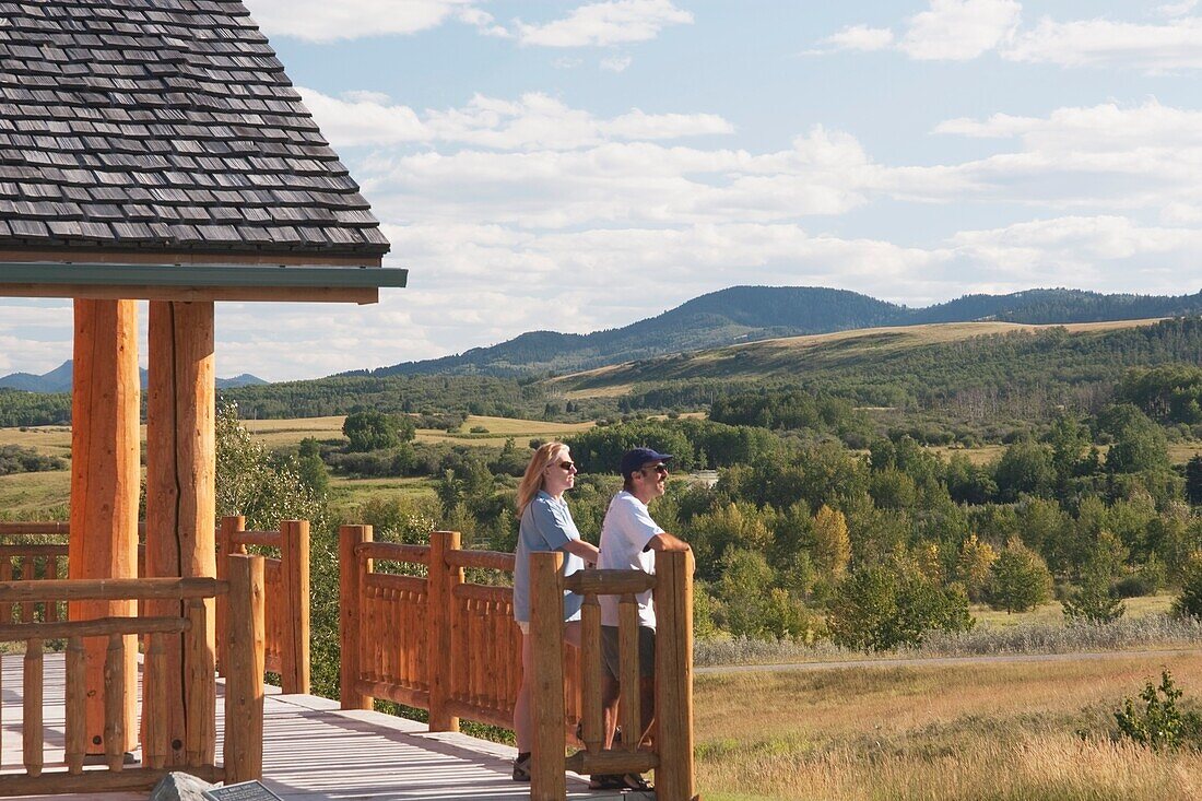 Couple Looking Out At The Hills