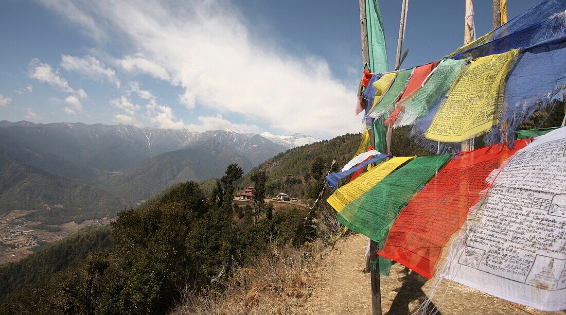 Buddhist Monastery And Prayer Flags Above Paro Valley