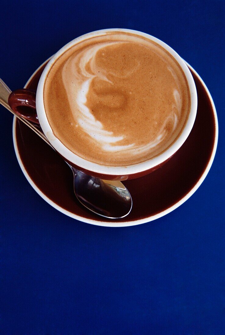Cappuccino On A Blue Table