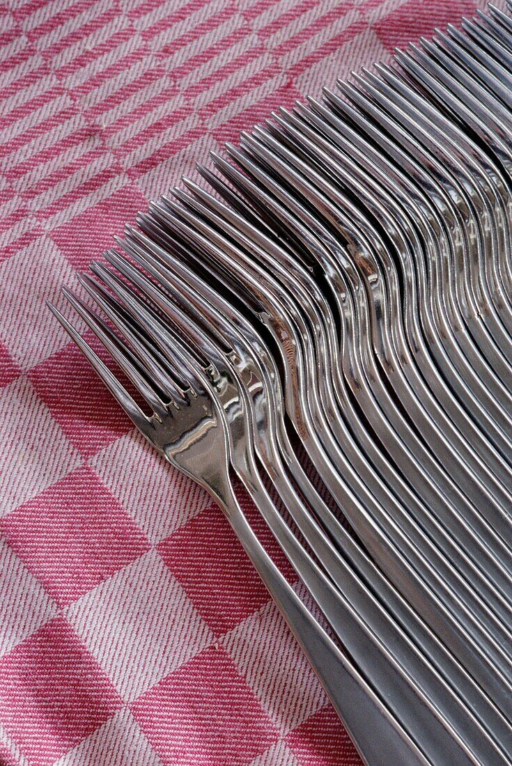 Stack Of Forks On A Table