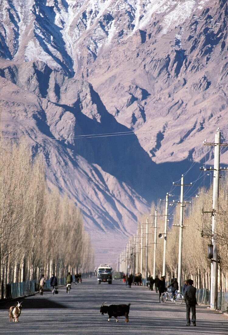 Urban Scene, Majestic Mountain Slope In Background