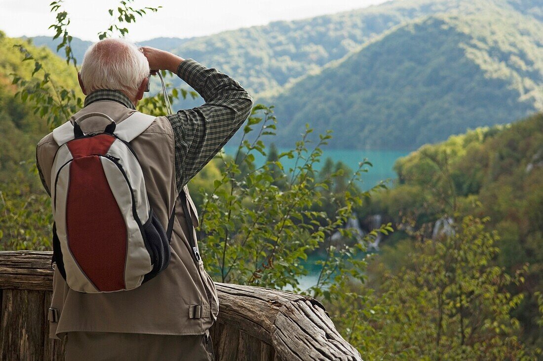 Tourist Photographing At Plitvice Lakes National Park.