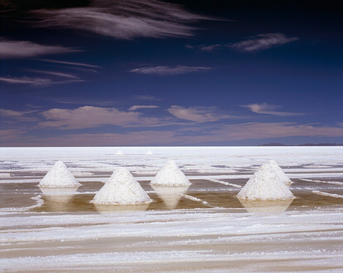 White Piles Of Salt In Stark Landscape