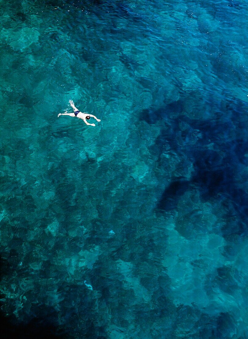 Tourist Swimming In The Sea
