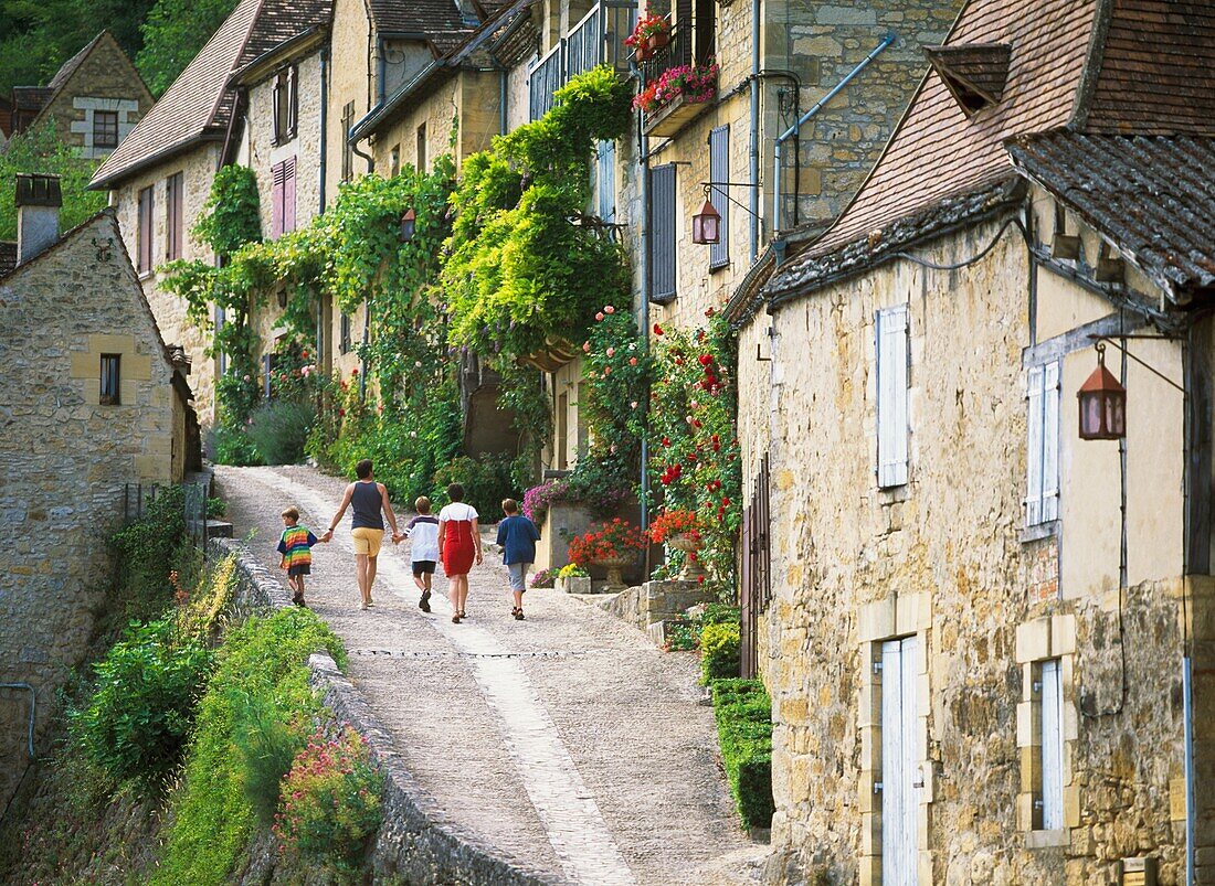 Family Walking In Old Town