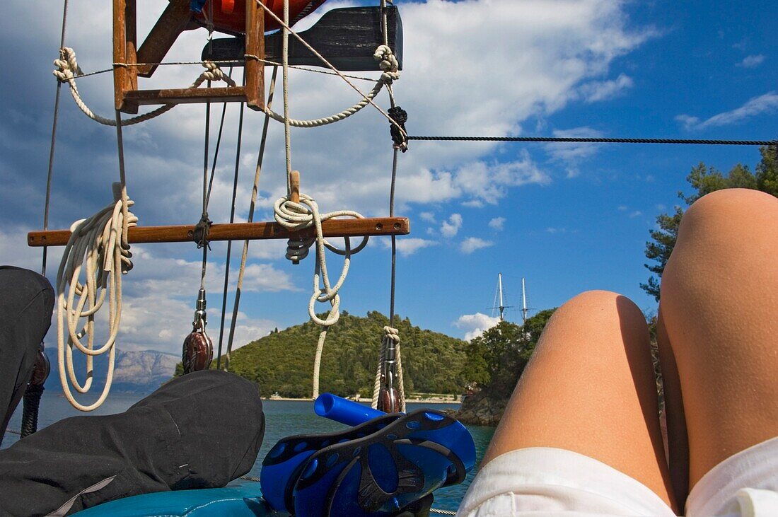 Couple Lying On Deck Of Yacht Sailing Near The Island Lefkas.