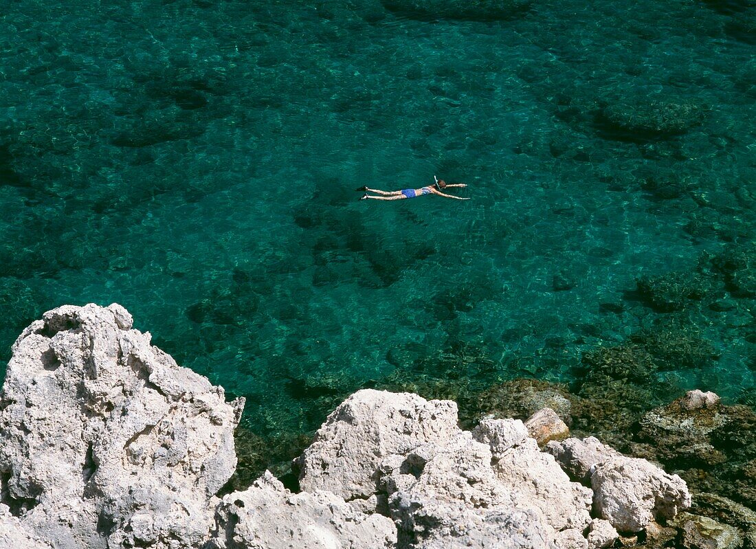 Woman Snorkeling In Anthony Quinn Bay