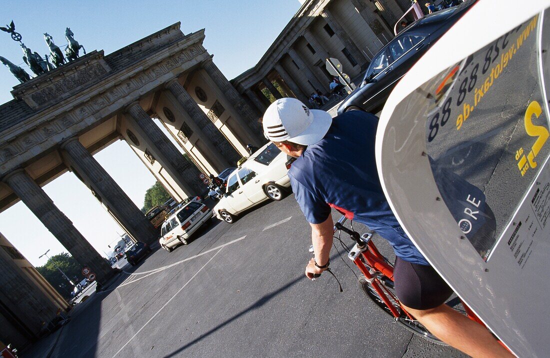 Cyclist And Brandenburg Gate