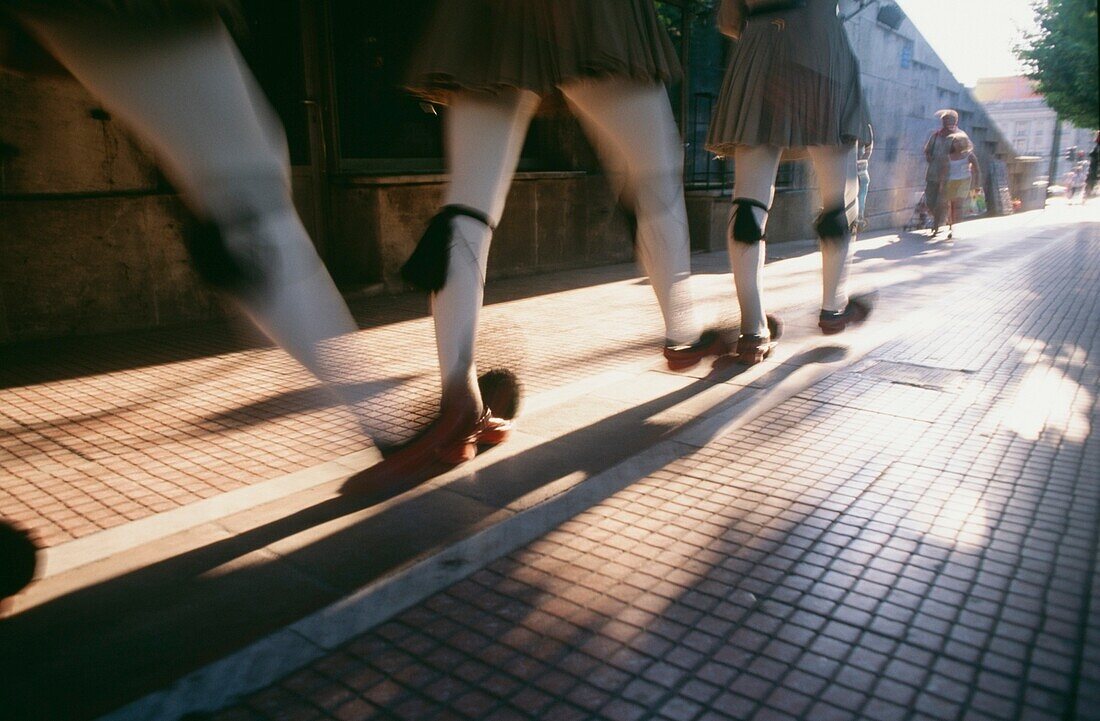 Legs Of Men Walking In Traditional Dress