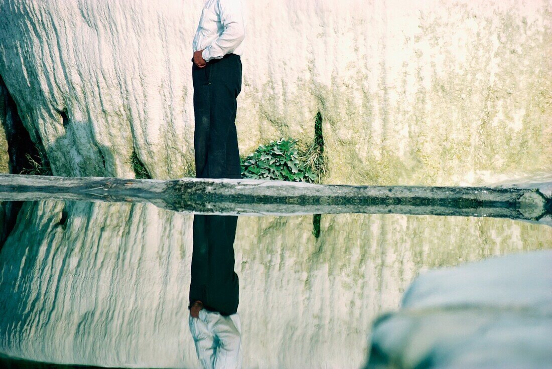 Man Standing By Water Pools In Pamukkale