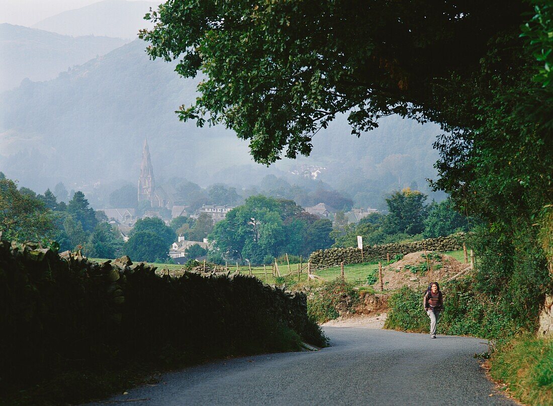 Walker Climbing Up Road Above Ambelside