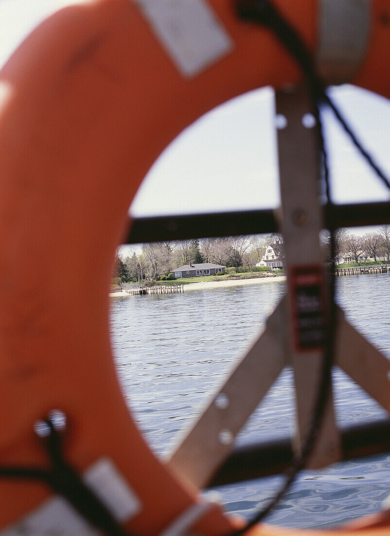 Looking Through A Buoy On A Ferry Towards Land