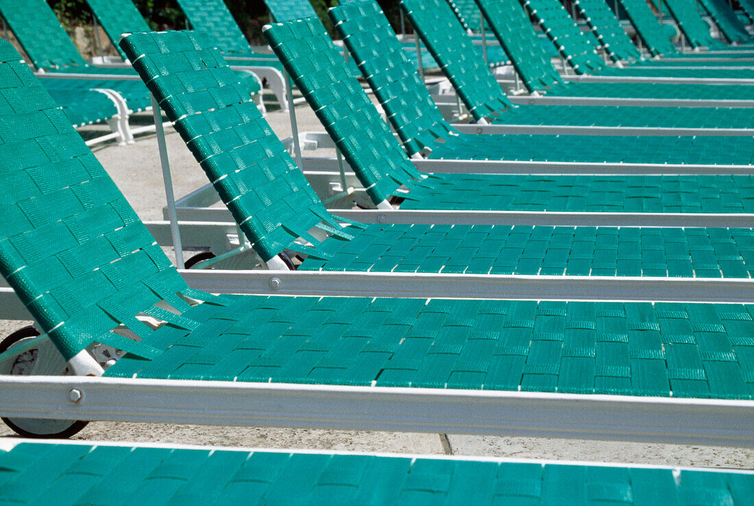 Empty Green Sun Loungers Lined Up In A Row