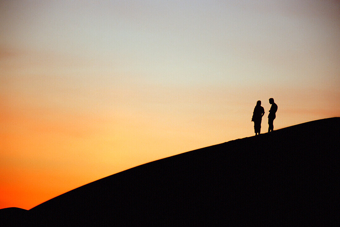 Tourists On Sand Dune At Sunset, Ubari Sand Sea