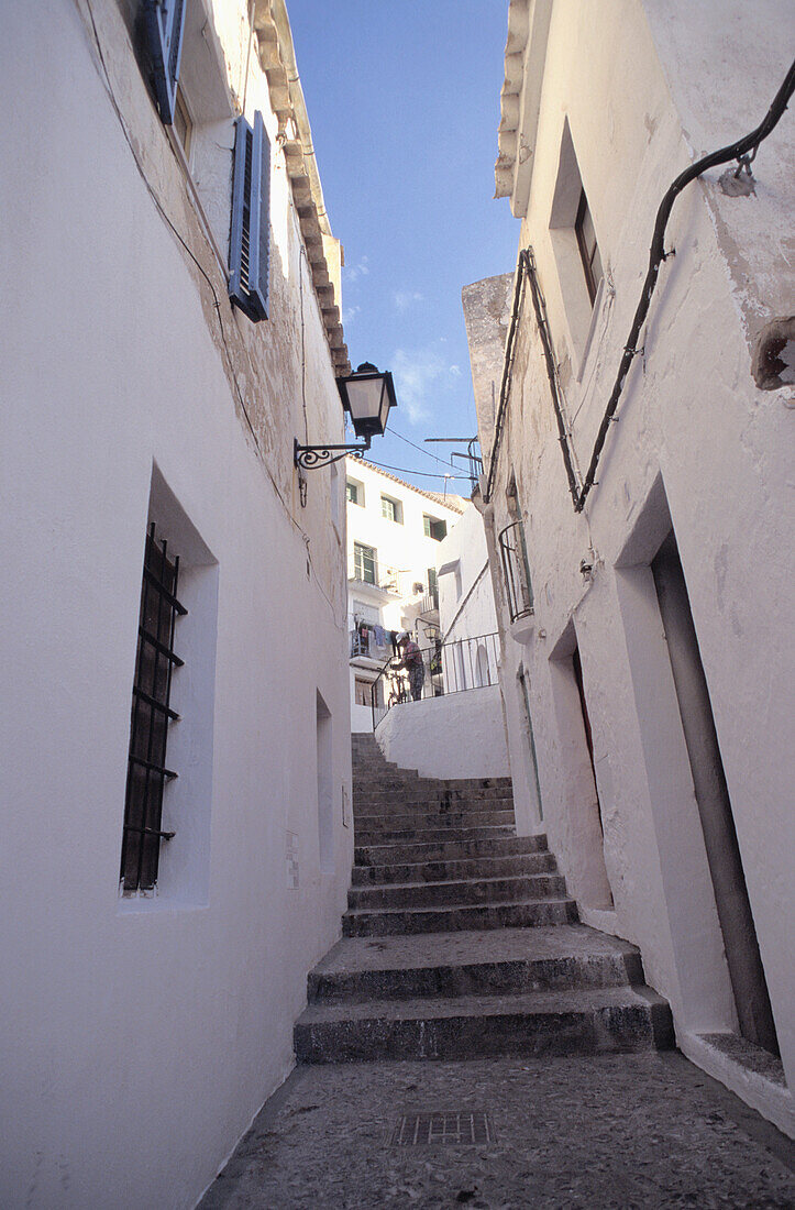 Whitewashed Buildings And Narrow Alleyway