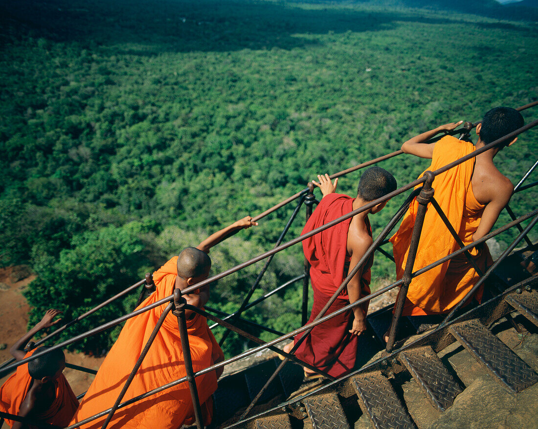 Buddhist Monks Climb Steep Steps Of Sigiriya Rock Fortress, Sigiriya