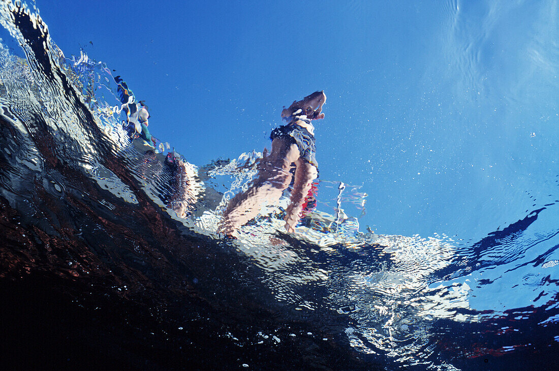 Girl On Diveboat Stern From Underwater