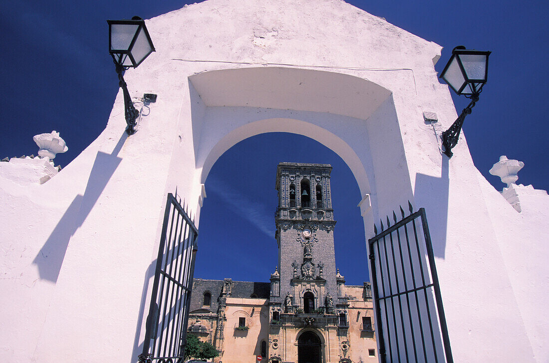 View Of Clock Tower Through Whitewashed Gate