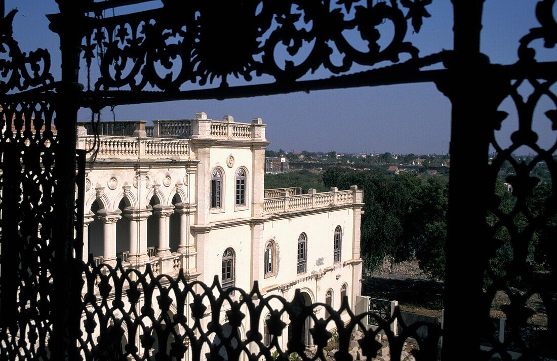 Old Palace As Seen Through Ornate Iron Screen