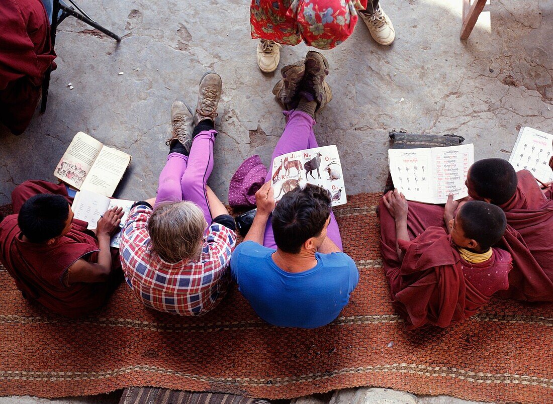 Tourists Teaching Young Monks English In Phuktal Monastery