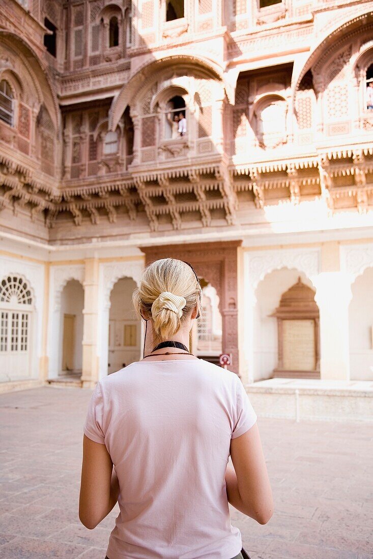 Blond Tourist Looking At Building In Fort Mehrangarh