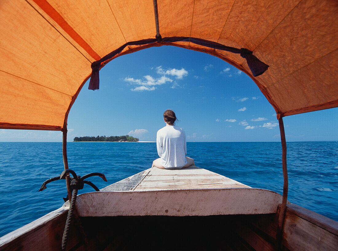 Tourist On Bow Of Motorized Dhow Heading Out To Prison Island