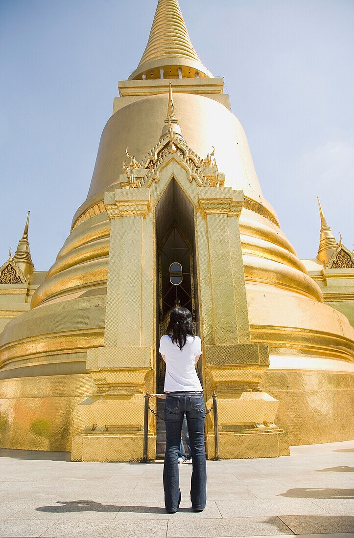 Woman Taking Pictures Of Phra Si Ratana Chedi At The Grand Palace