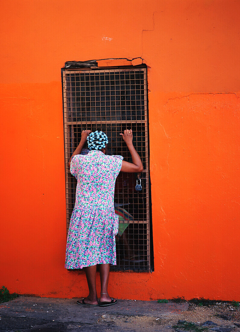 Woman In Hair Curlers Looking In