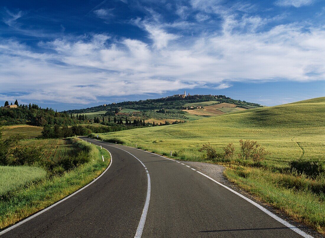 Paved Road Winding Through Tuscan Countryside