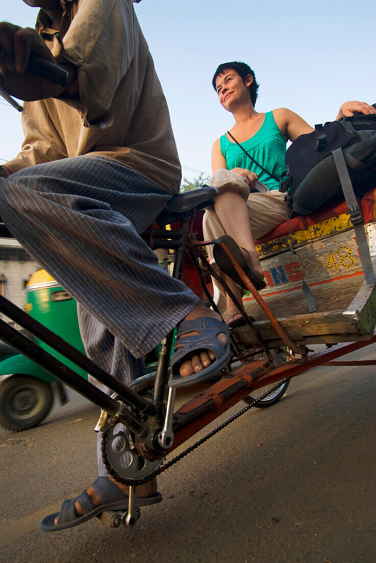 Woman With Rucksack On Cycle Rickshaw