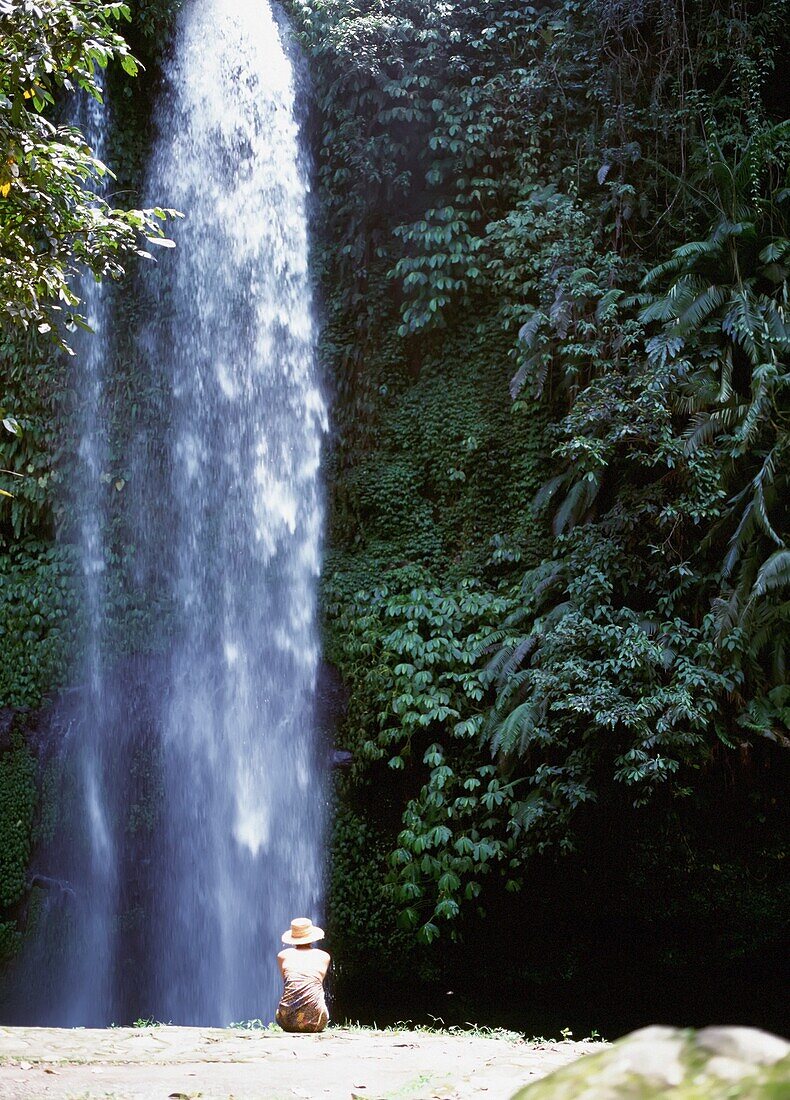 Woman Sitting Beside Waterfall, Sendang Gila