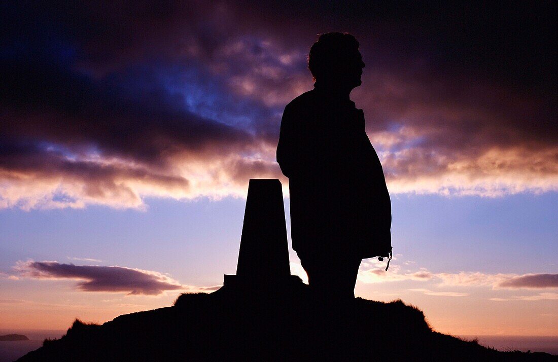 Man In Silhouette Atop Seefin