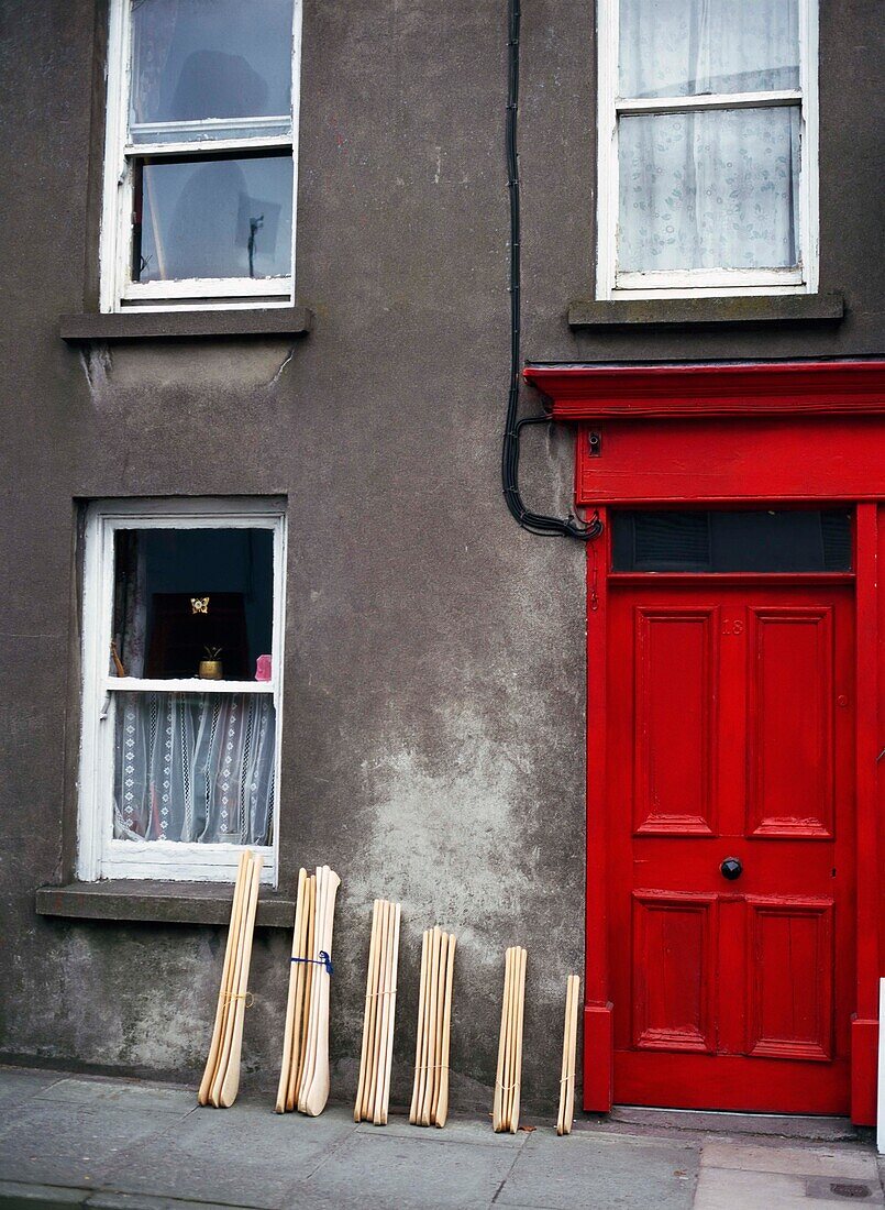 Hurling Sticks Outside Doorway Of House, Close Up