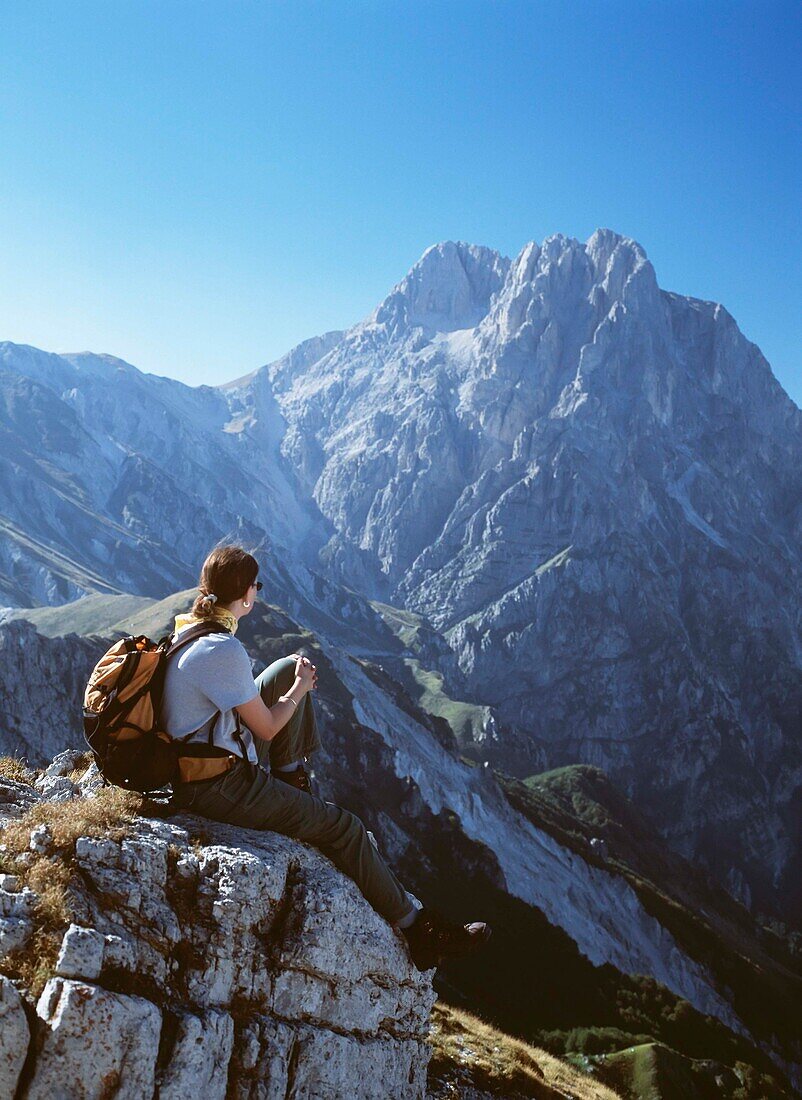 Woman Resting On Ridge In Front Of Corno Grande In The Campo Imperatore