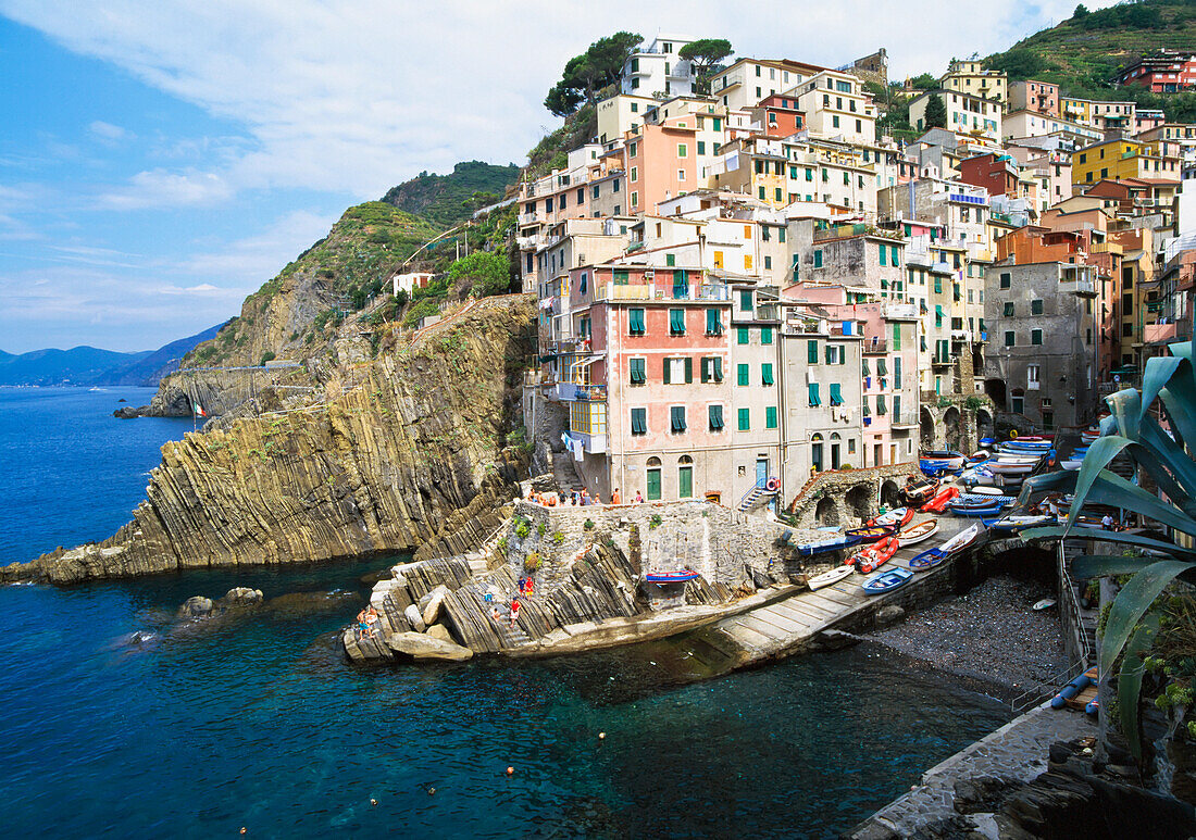 View Of The Village Of Riomaggiore Built Over A Cliff.