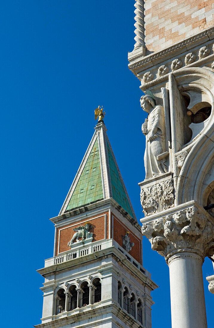 Sculpture On Corner Of Palazzo Ducale Facade And The Campanile Di San Marco.