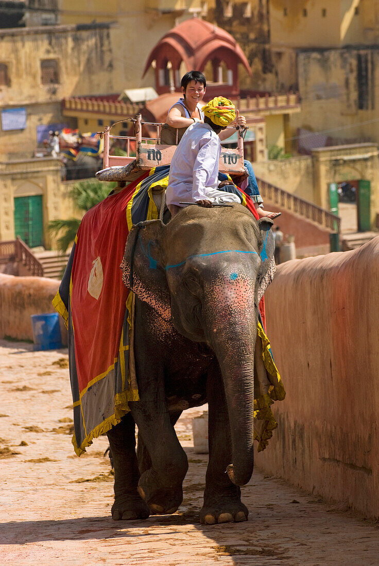 Mahout And Tourist On Elephant At Amber Fort