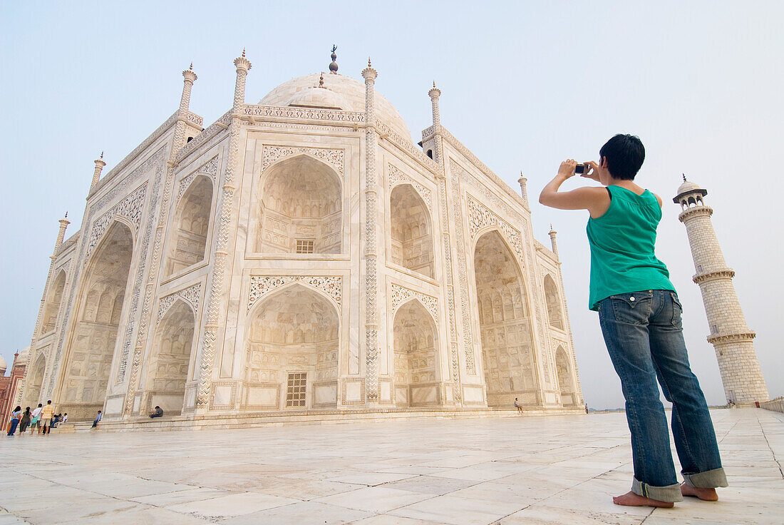 Woman Photographing The Taj Mahal At Dawn