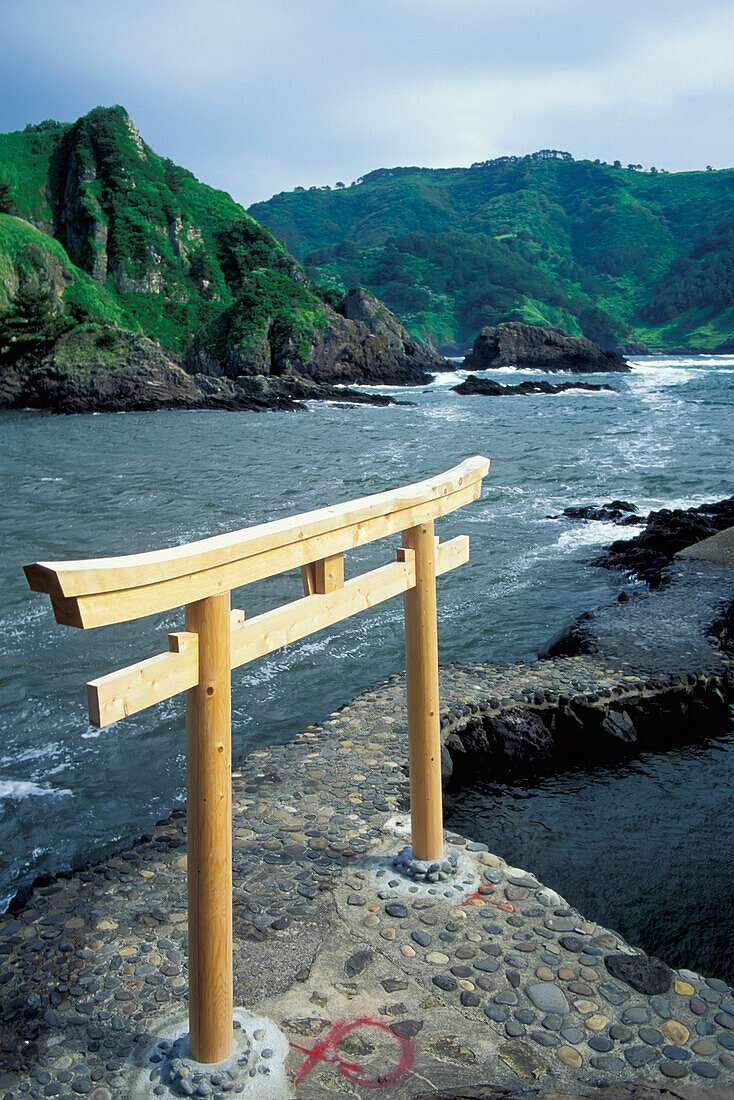 Wooden Tori Gate On Path Along Coastline