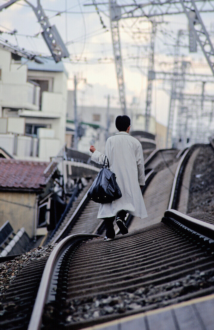 Man Walking On Railway Lines After Earthquake