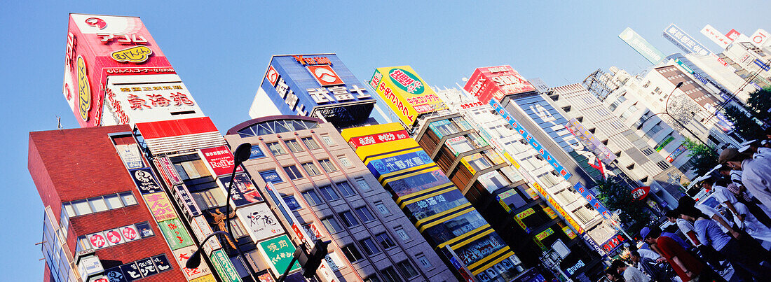 Buildings Covered In Advertising Signs In Shinjuku