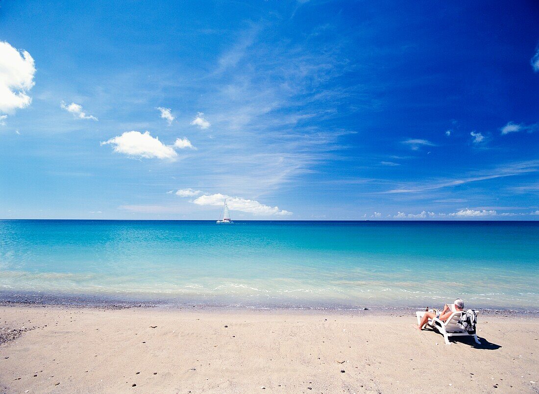 Man Relaxing On Beach Chair Sun Lounger