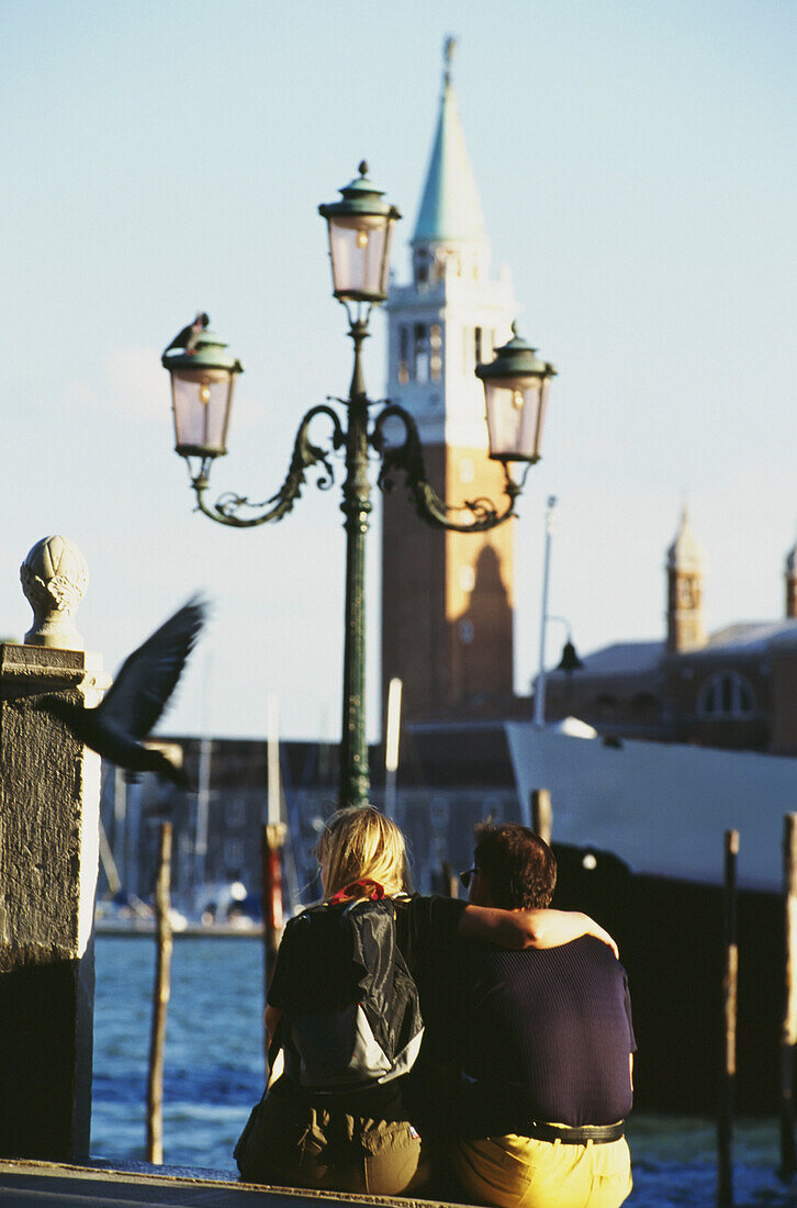 Couple Sitting Outside Palazzo Ducale